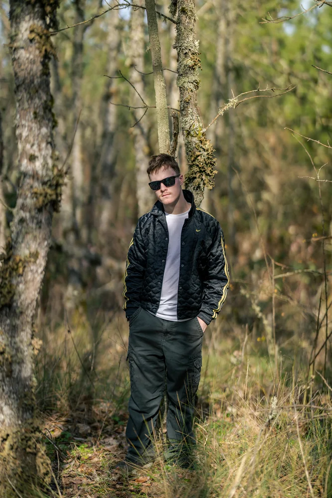 Jaxen Reynolds standing among trees