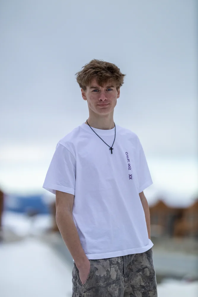 Portrait in a white shirt against a softly blurred background