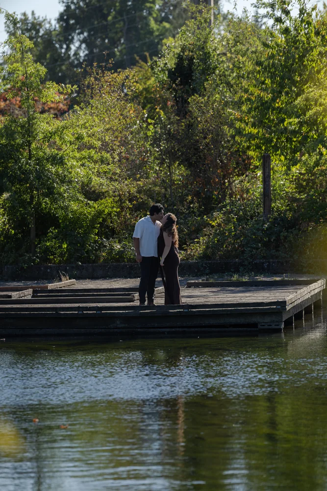 A couple together on a dock after the proposal