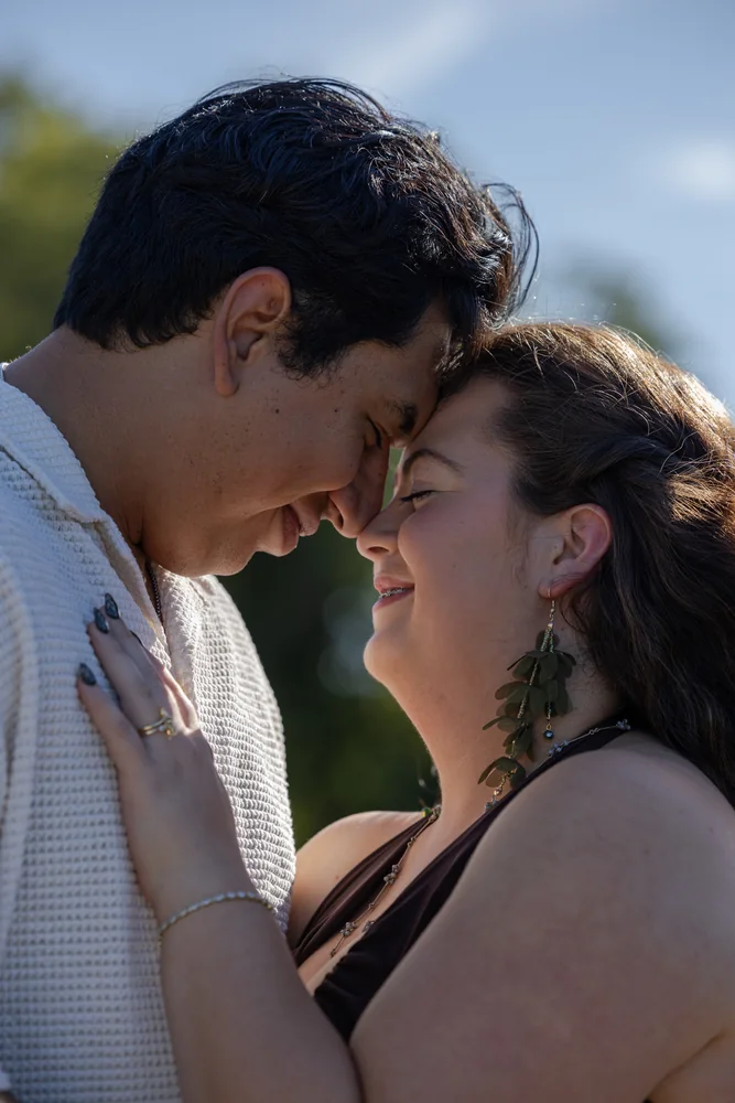 Close portrait of the couple touching foreheads