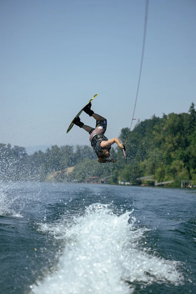 Wakeboarder in the air above the boat's wake