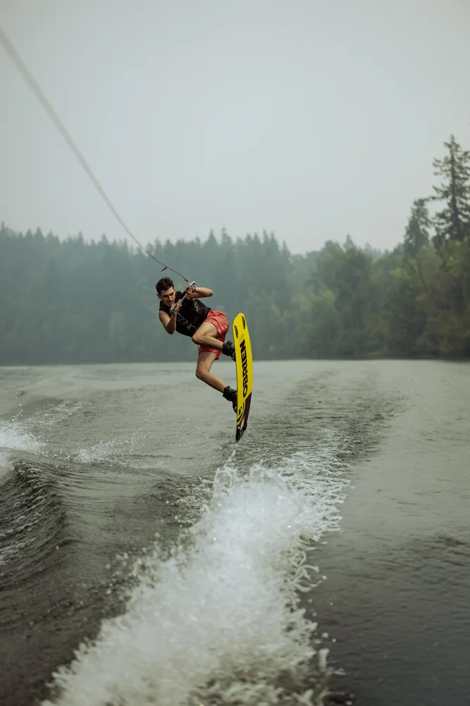 Wakeboarder jumping above the water